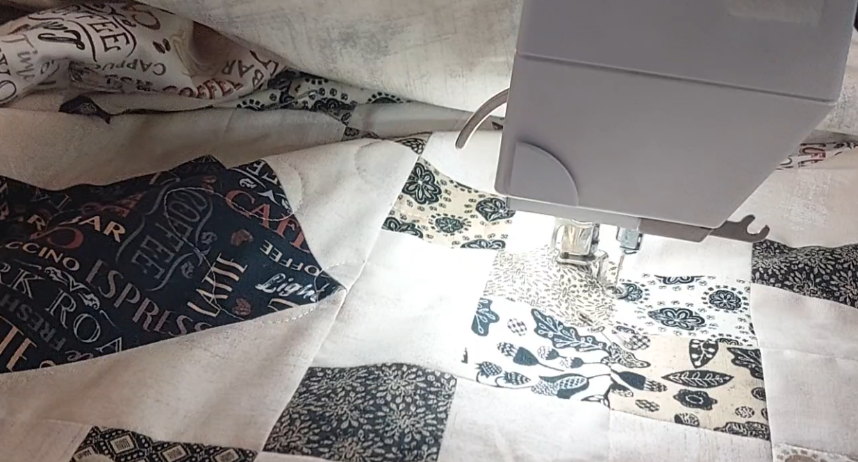 custom coffee quilt being quilted