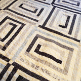 Detail shot of handmade quilt showing close up of blocks and quilt stitching