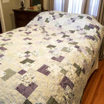 Au Naturel handmade quilt shown in in a minimal bedroom