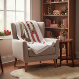 Holiday quilt draped over an armchair in a cozy reading nook