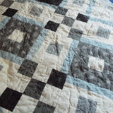 Quilt stitching detail of modern black and white handmade quilt