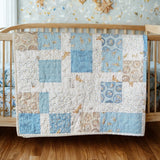 Handmade blue baby quilt draped over wooden crib in nursery with wood floors