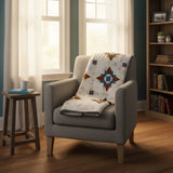 Starry Comfort quilt folded over the back of a chair in a reading nook.