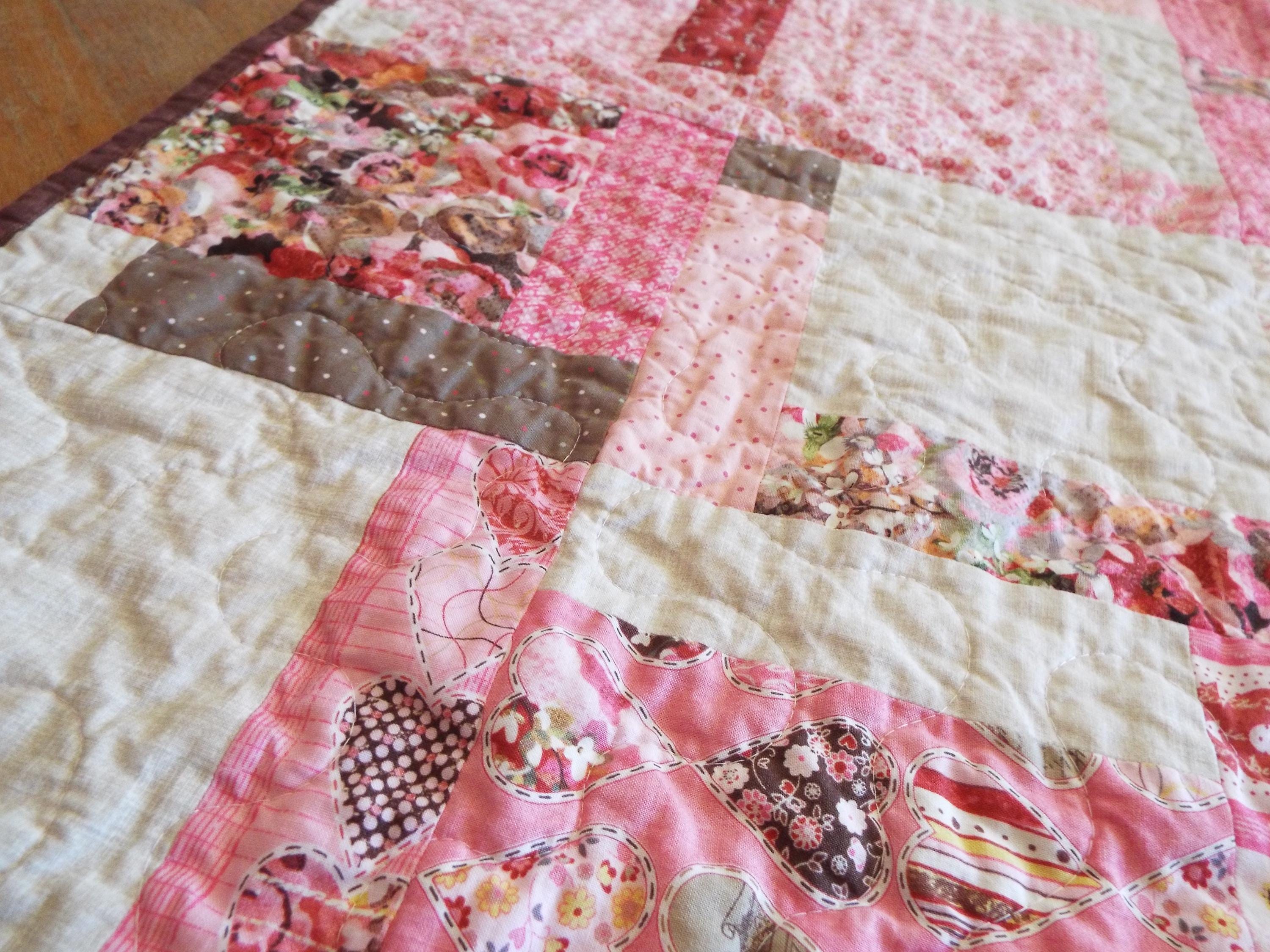 Hearts and Flowers Throw quilt at an angle
