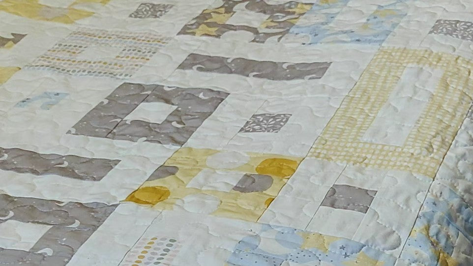 Baby quilt in squares and rectangle
