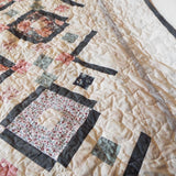 Close up of stitching on handmade twin floral quilt