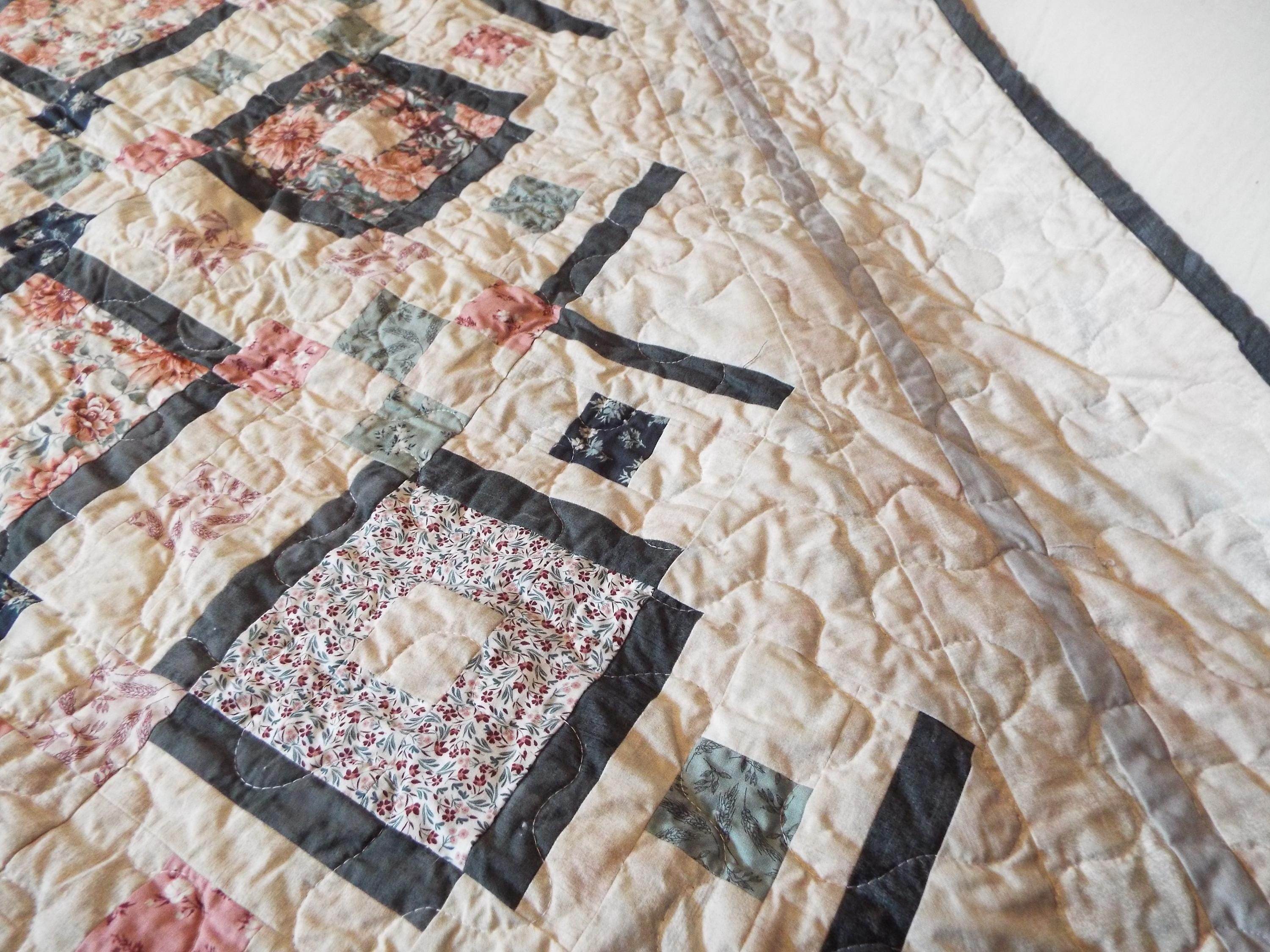 Close up of stitching on handmade twin floral quilt