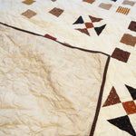 Adamstown Queen shown with the corner flipped to see backing and quilt top together.