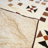 Adamstown Queen shown with the corner flipped to see backing and quilt top together.