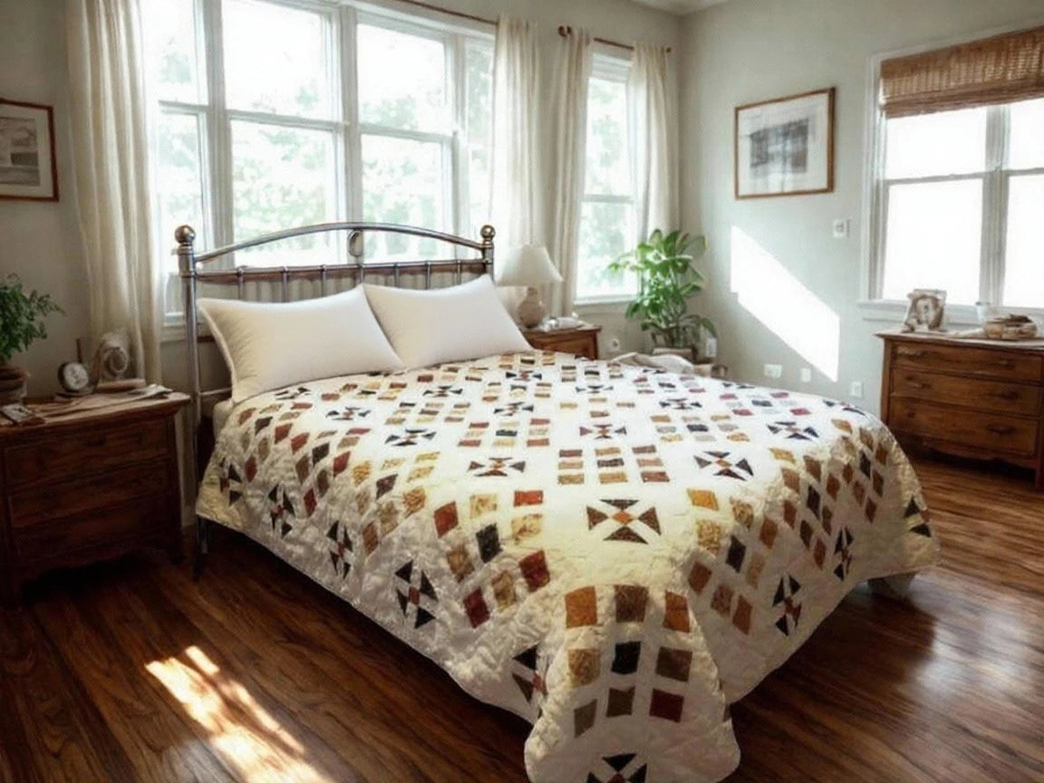 Adamstown quilt displayed on a bed in an airy bedroom with wooden floors and dressers