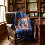 Air Force Eagle Throw Quilt is draped over a brown leather armchair in a classic wood-paneled study with bookshelves and a desk.