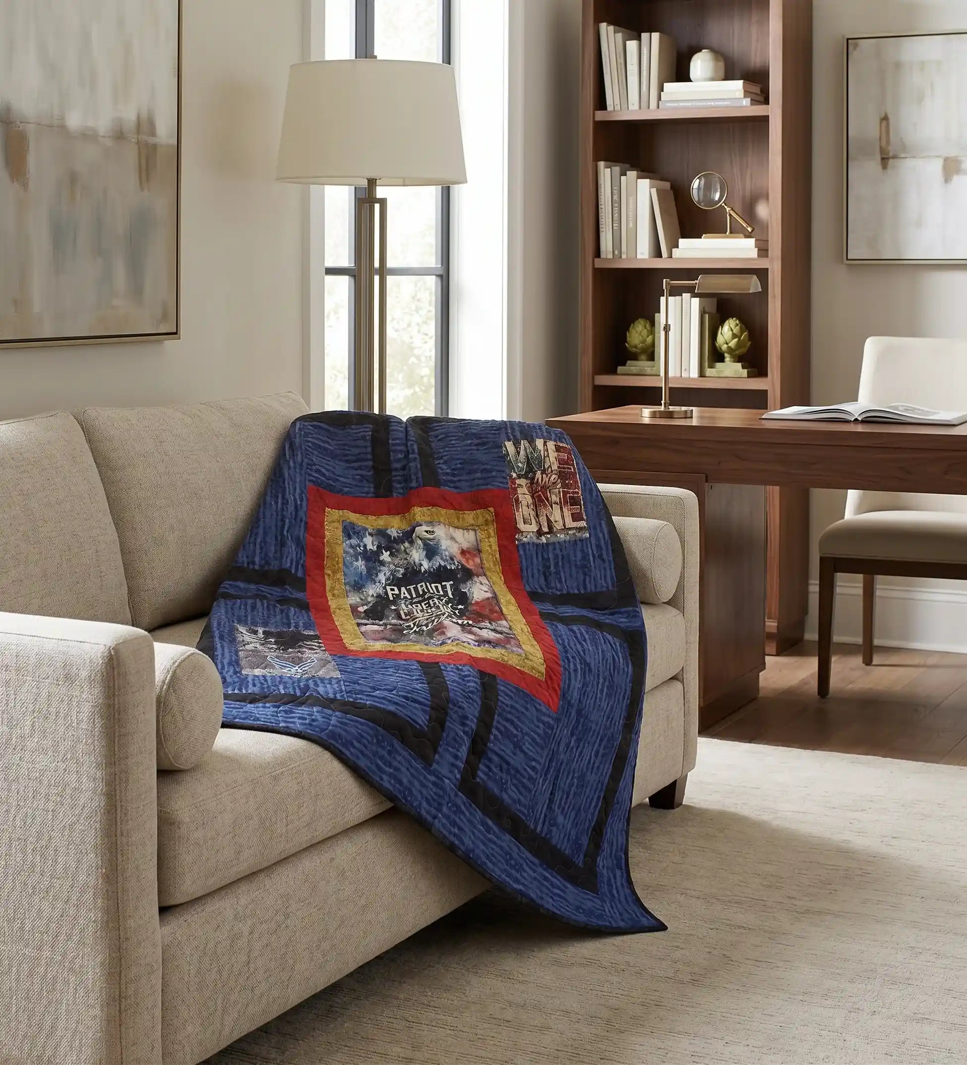 Air Force Eagle Throw Quilt is draped over a beige sofa in a modern home office setting.