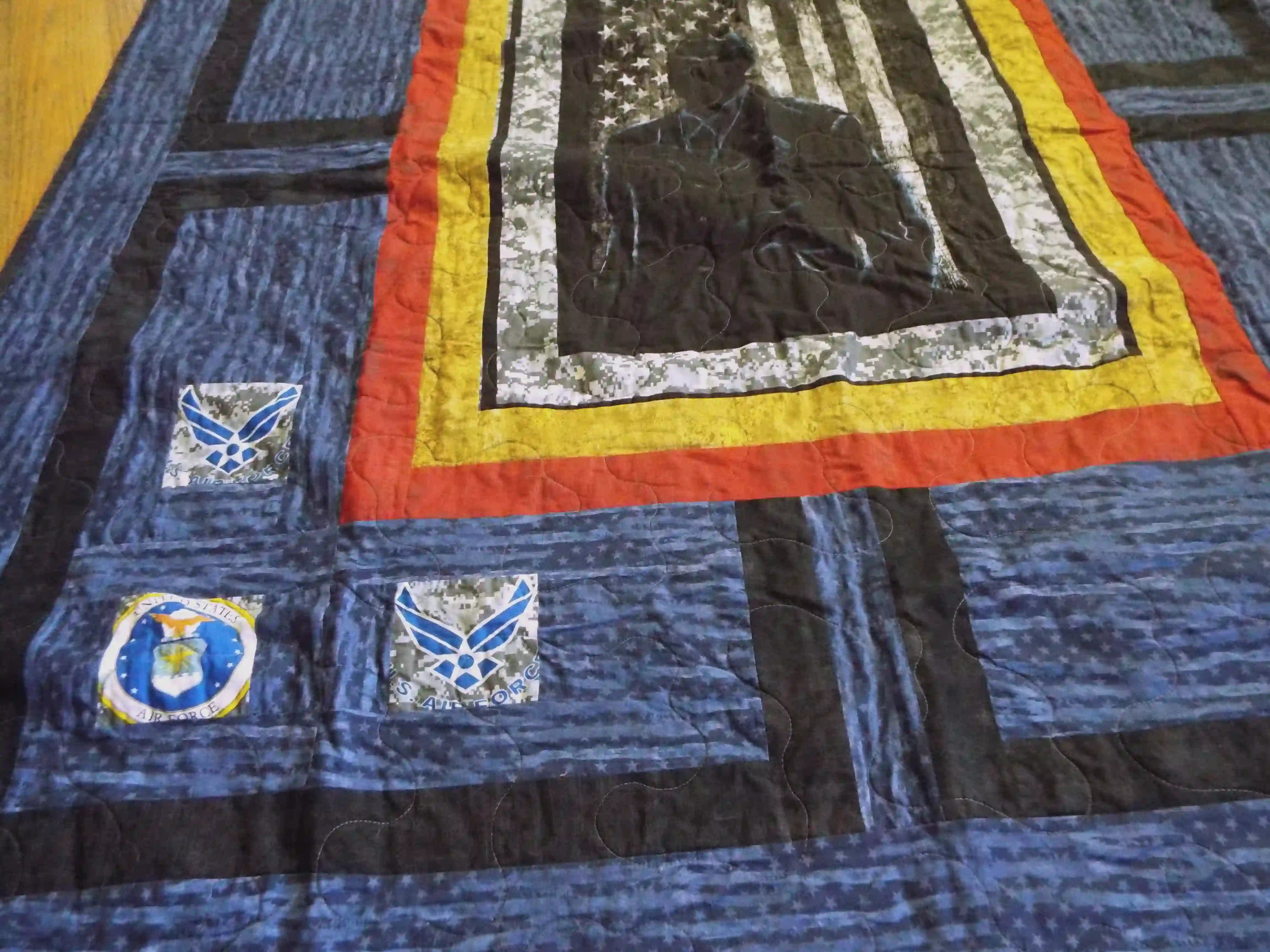 Angled lay of Air Force Airman showing more detail of the insignia patchwork in the corners of the quilt.
