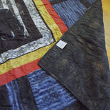 Corner flipped over on Air Force Airman Throw Quilt showing the backing of the quilt.