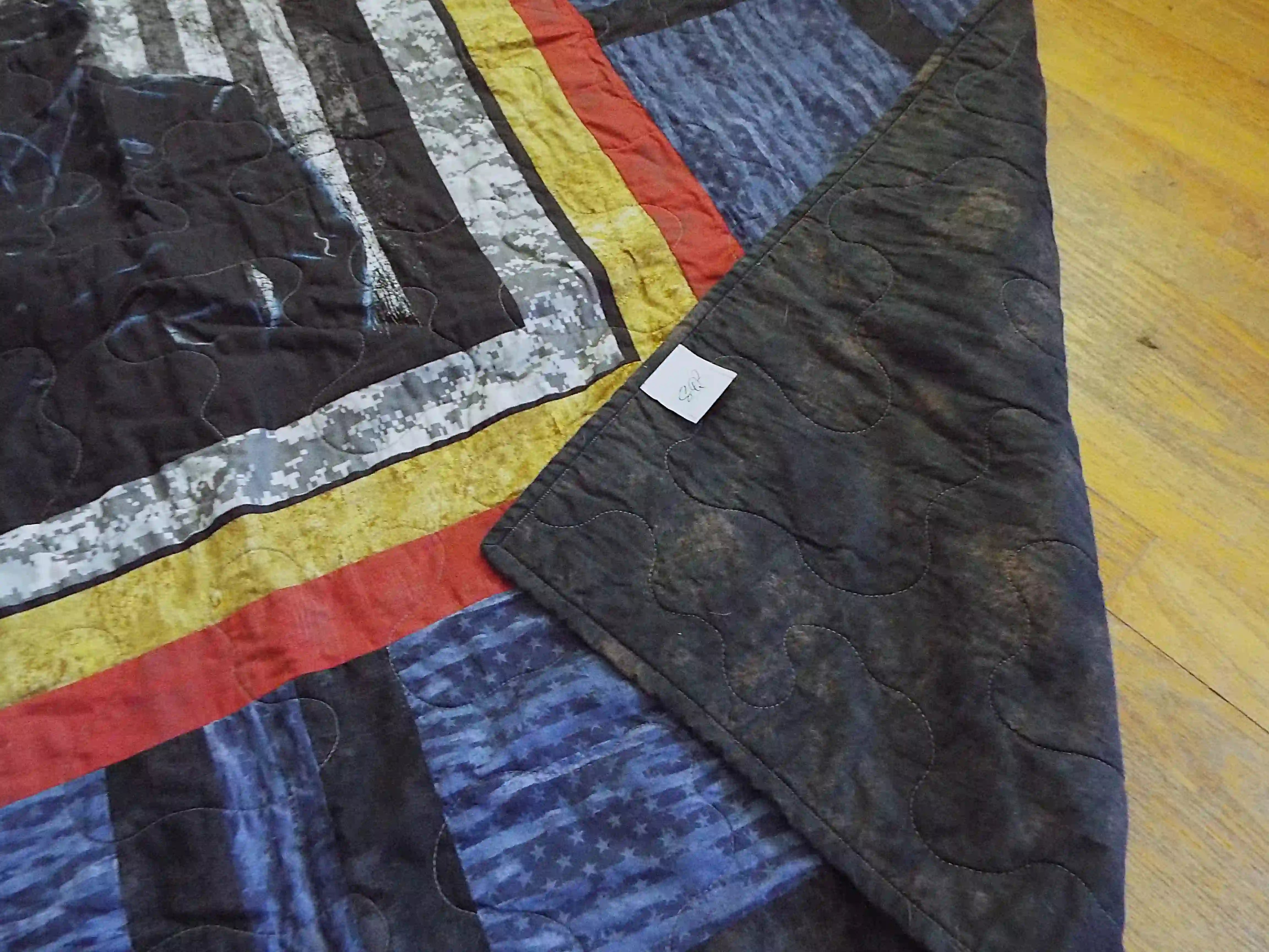 Corner flipped over on Air Force Airman Throw Quilt showing the backing of the quilt.