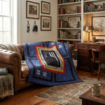 Air Force Airman Throw Quilt shown over a camel colored sofa in a heritage-study styled room.