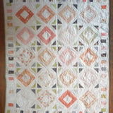 Flat lay of handmade quilt showing entire quilt.