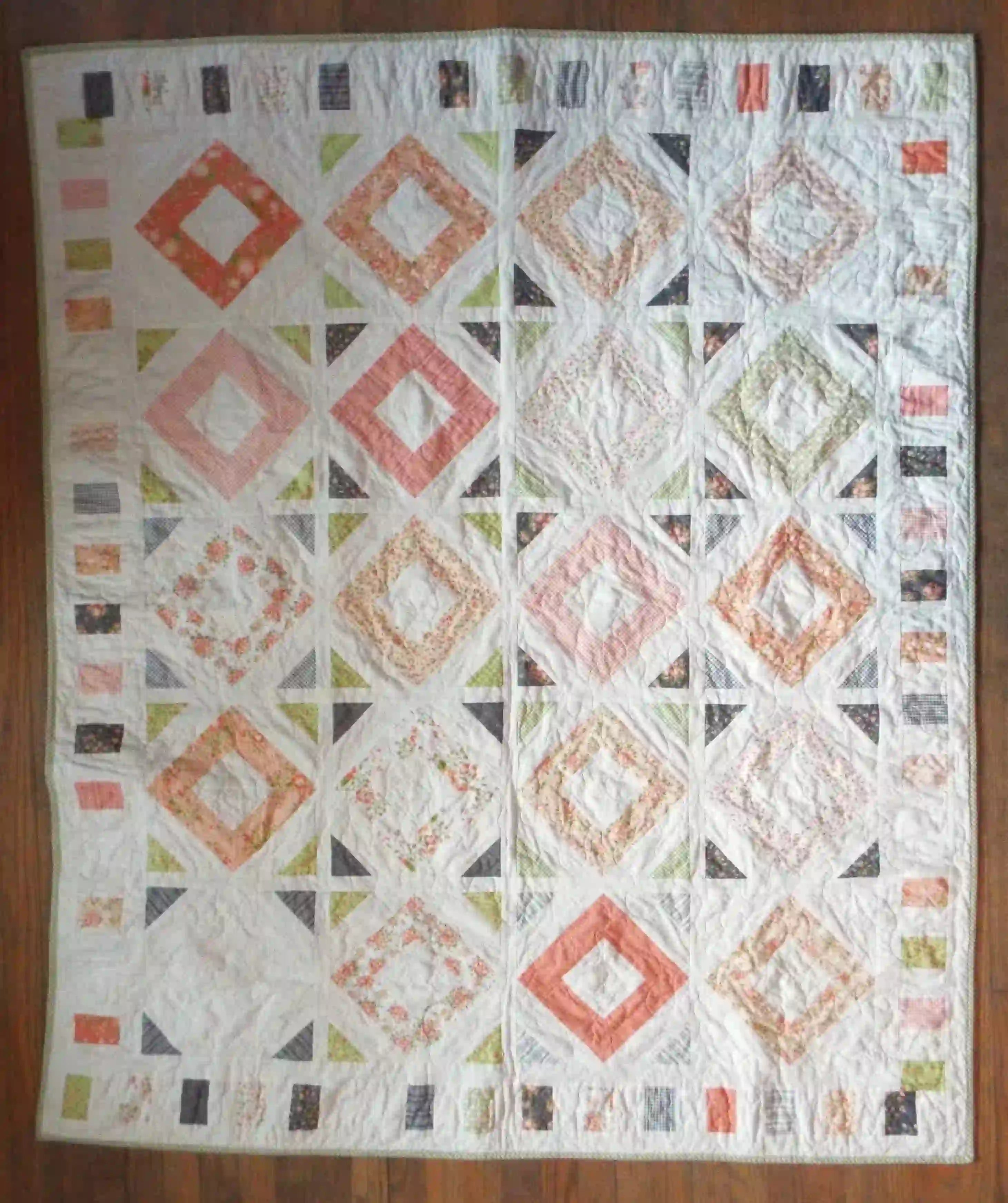 Flat lay of handmade quilt showing entire quilt.