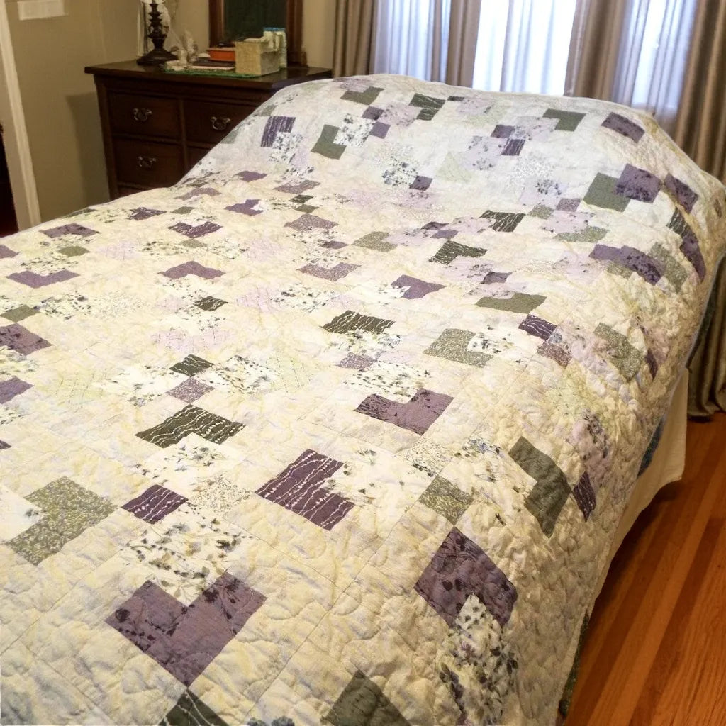 Au Naturel handmade quilt shown in in a minimal bedroom