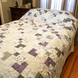 Au Naturel handmade quilt shown in in a minimal bedroom