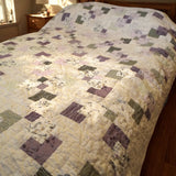 Twin-sized handmade quilt close view in a minimal bedroom