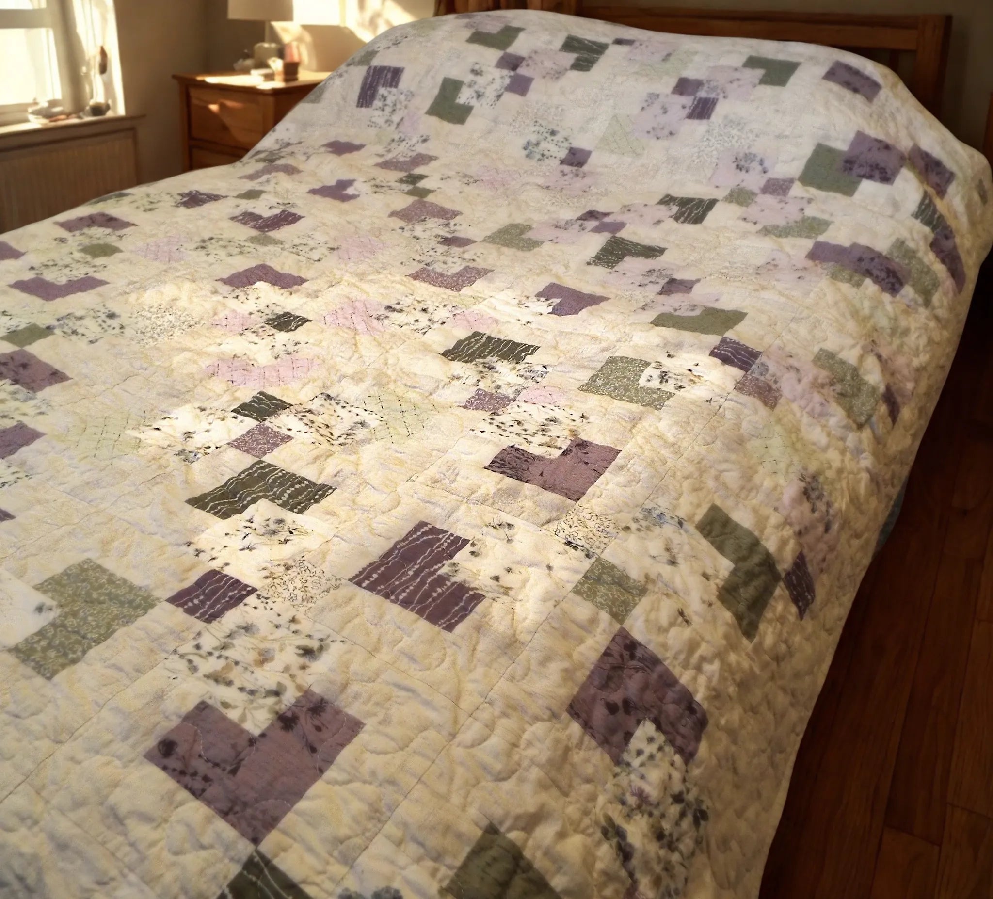 Twin-sized handmade quilt close view in a minimal bedroom