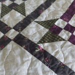Detail shot of Avonlea Garden Twin Quilt showing quilt stitching and piecing detail.