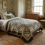 Avonlea Garden Twin Quilt shown in an English country inspired bedroom with botanical wallpaper.