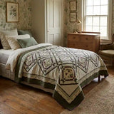 Avonlea Garden Twin Quilt shown in an English country inspired bedroom with botanical wallpaper.