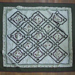 Flat lay of Avonlea Garden Twin Quilt showing entire quilt.