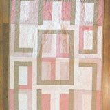 Flat lay of Blushing Pathways Baby Quilt showing entire pattern.