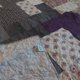 Bramble & Stone King quilt shown with corner flipped over to show backing against quilt top.