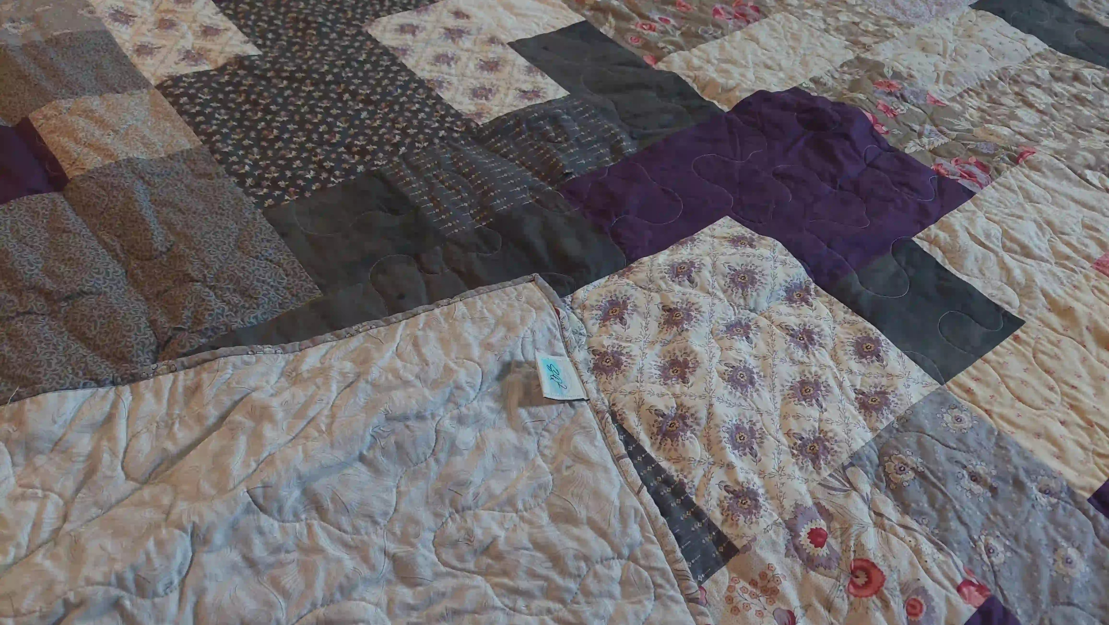 Bramble & Stone King quilt shown with corner flipped over to show backing against quilt top.