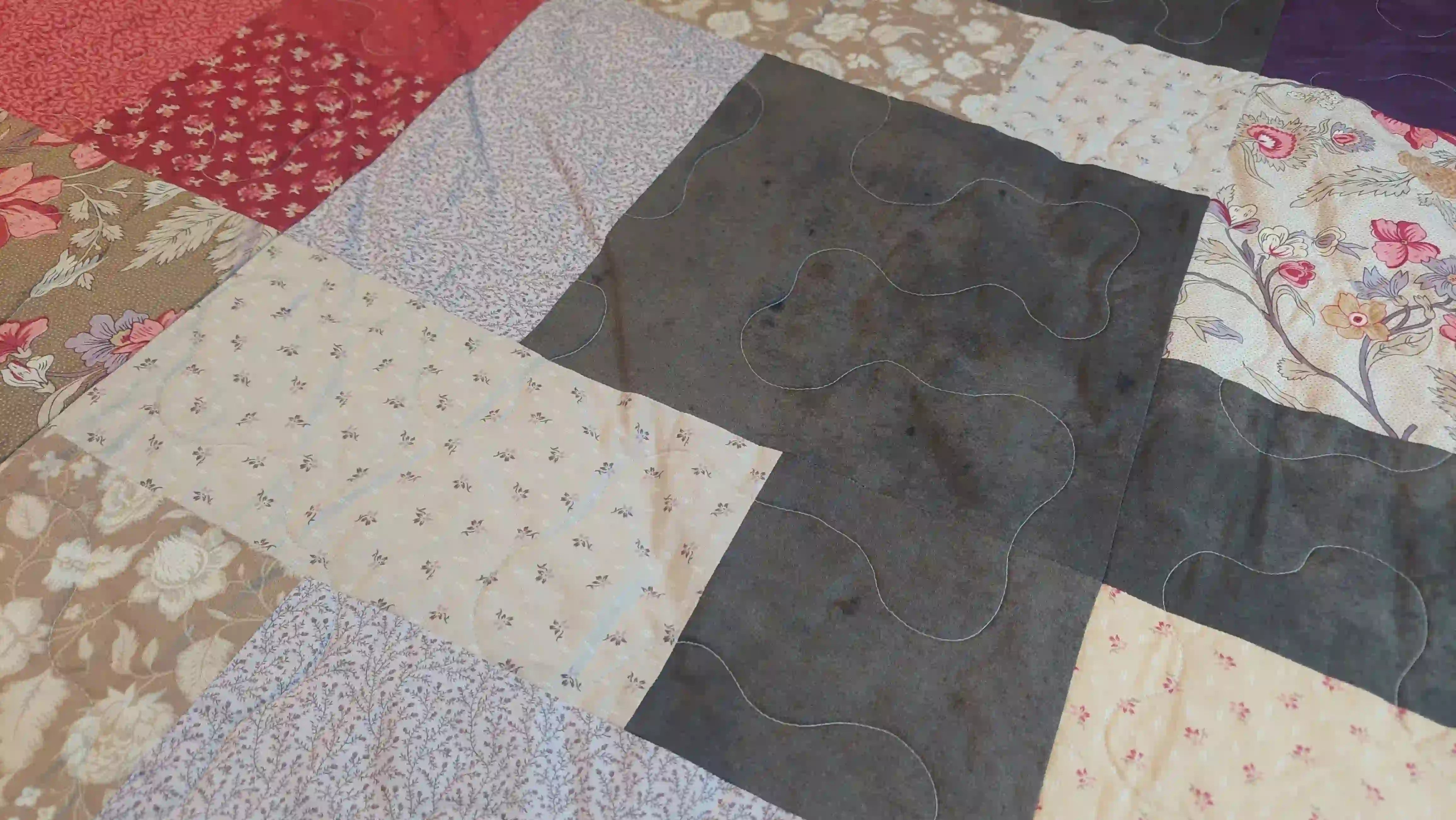 Detail shot of Bramble & Stone King quilt showing stitching detail.