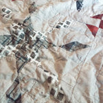 Closer look at Cartographer's Notes Queen Quilt showing fabric, piecing, and stitching detail.
