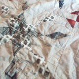 Closer look at Cartographer's Notes Queen Quilt showing fabric, piecing, and stitching detail.