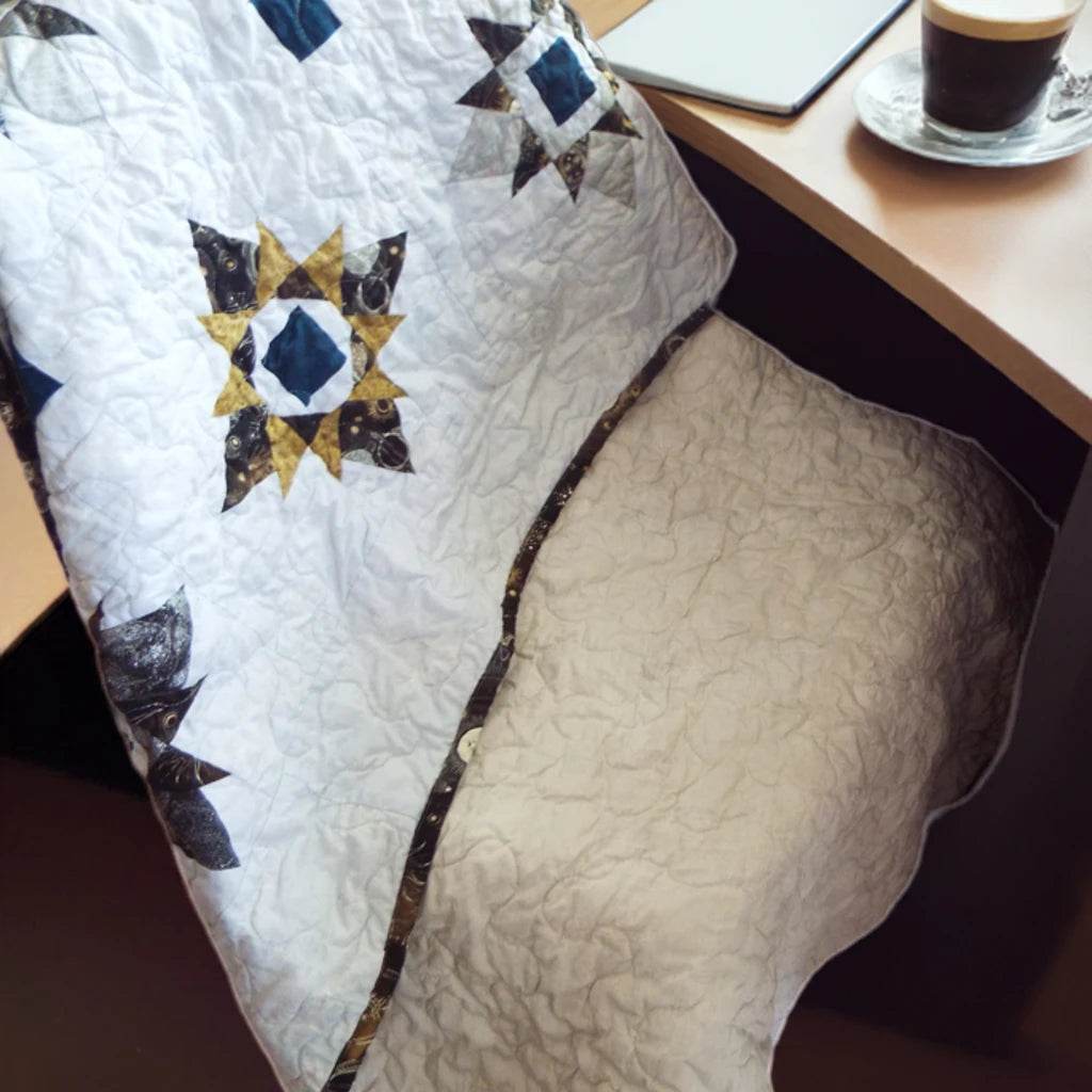 celestial cozy quilt over chair at desk