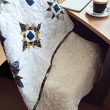 celestial cozy quilt over chair at desk
