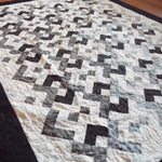 Angled lay of quilt showing stitching detail