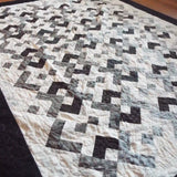 Angled lay of quilt showing stitching detail