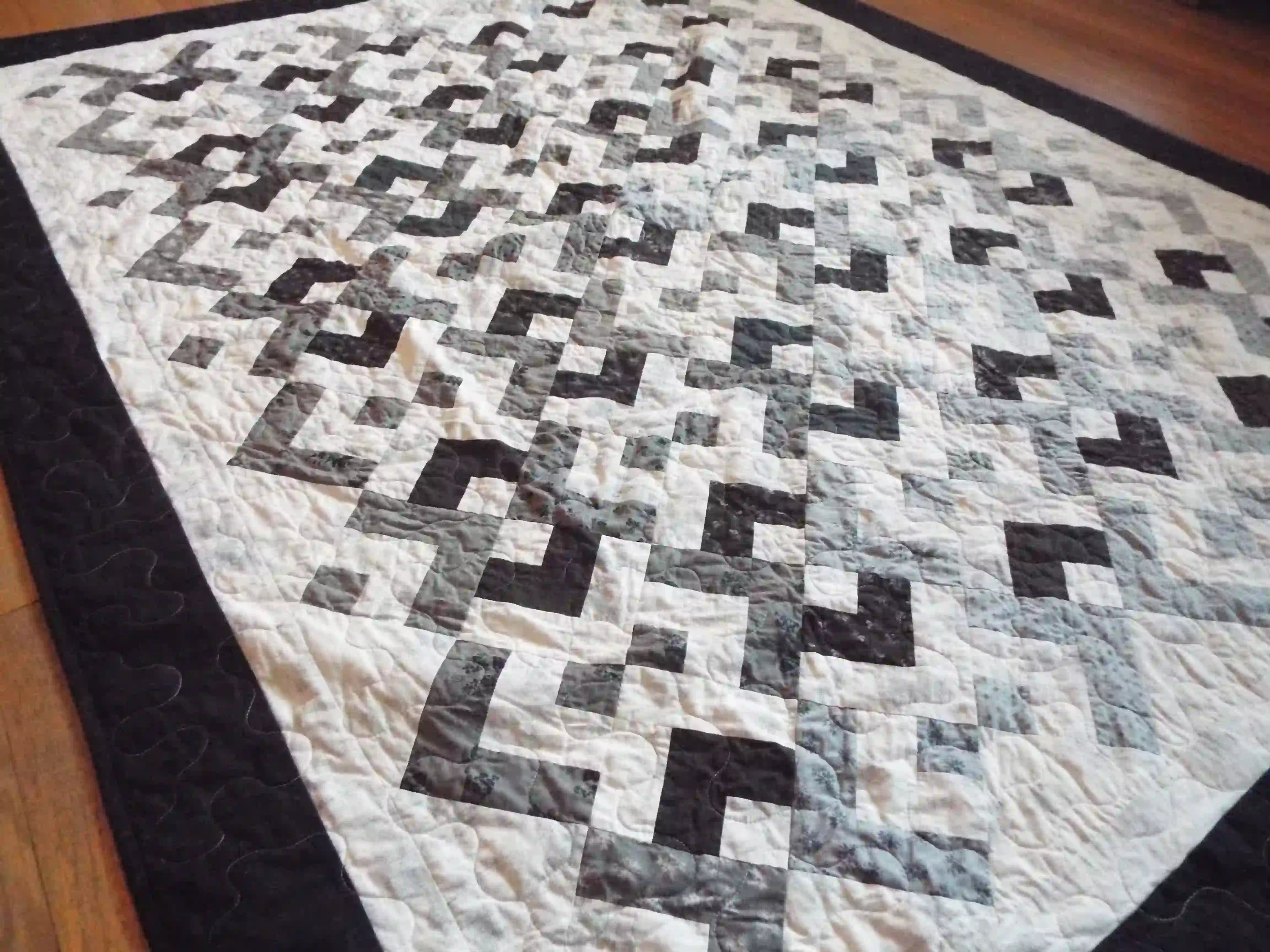 Angled lay of quilt showing stitching detail