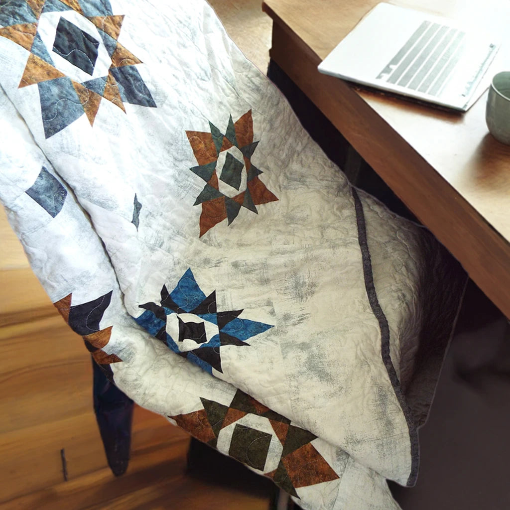 starry comfort quilt over chair at desk