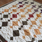 Embers at Dusk lap quilt angled lay