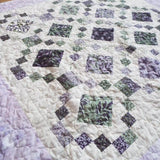 Angled lay of Evening Lattice lap quilt
