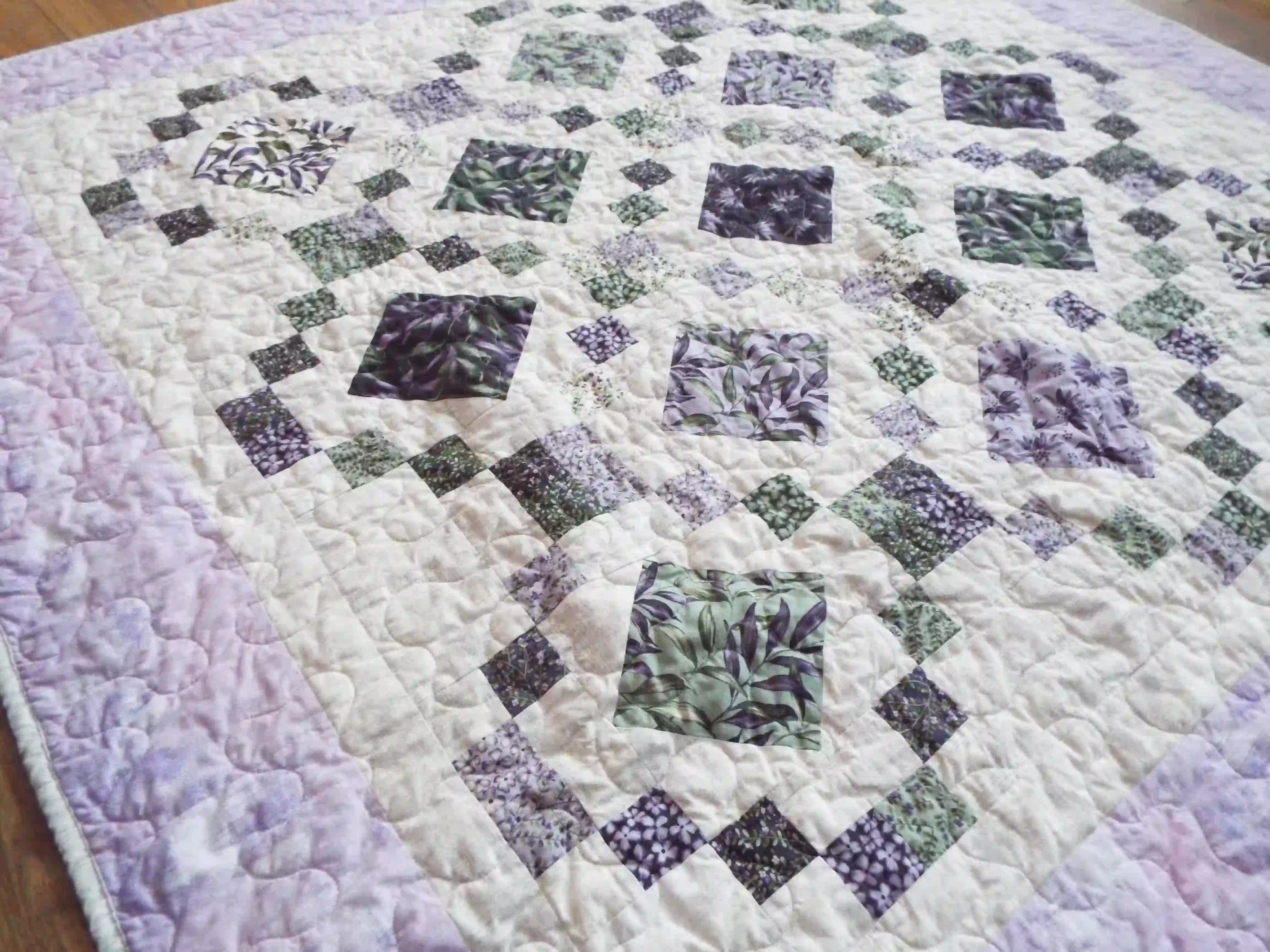 Angled lay of Evening Lattice lap quilt