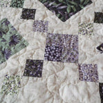 Close up of Evening Lattice showing texture from quilting and fabric patterns