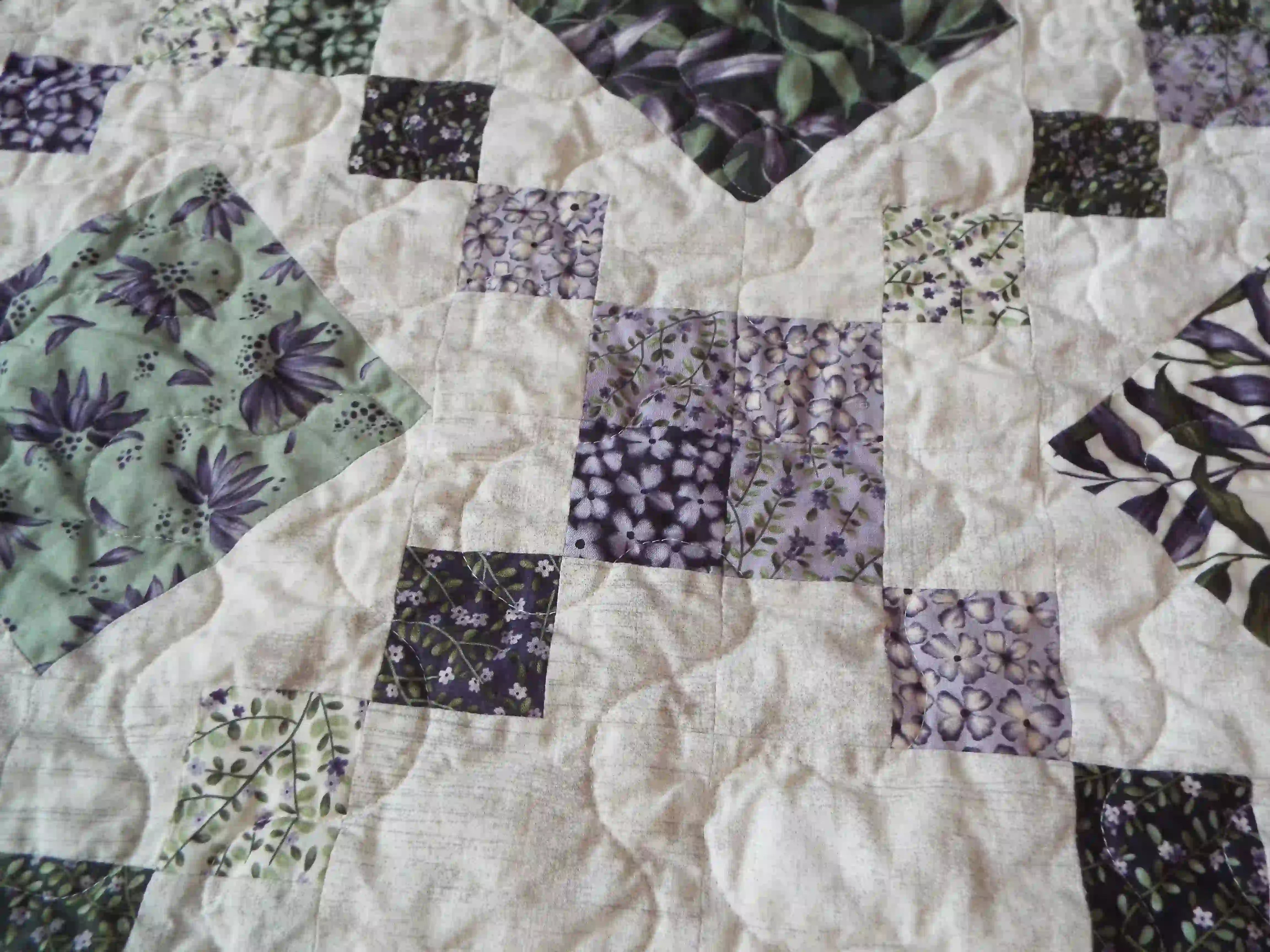 Close up of Evening Lattice showing texture from quilting and fabric patterns