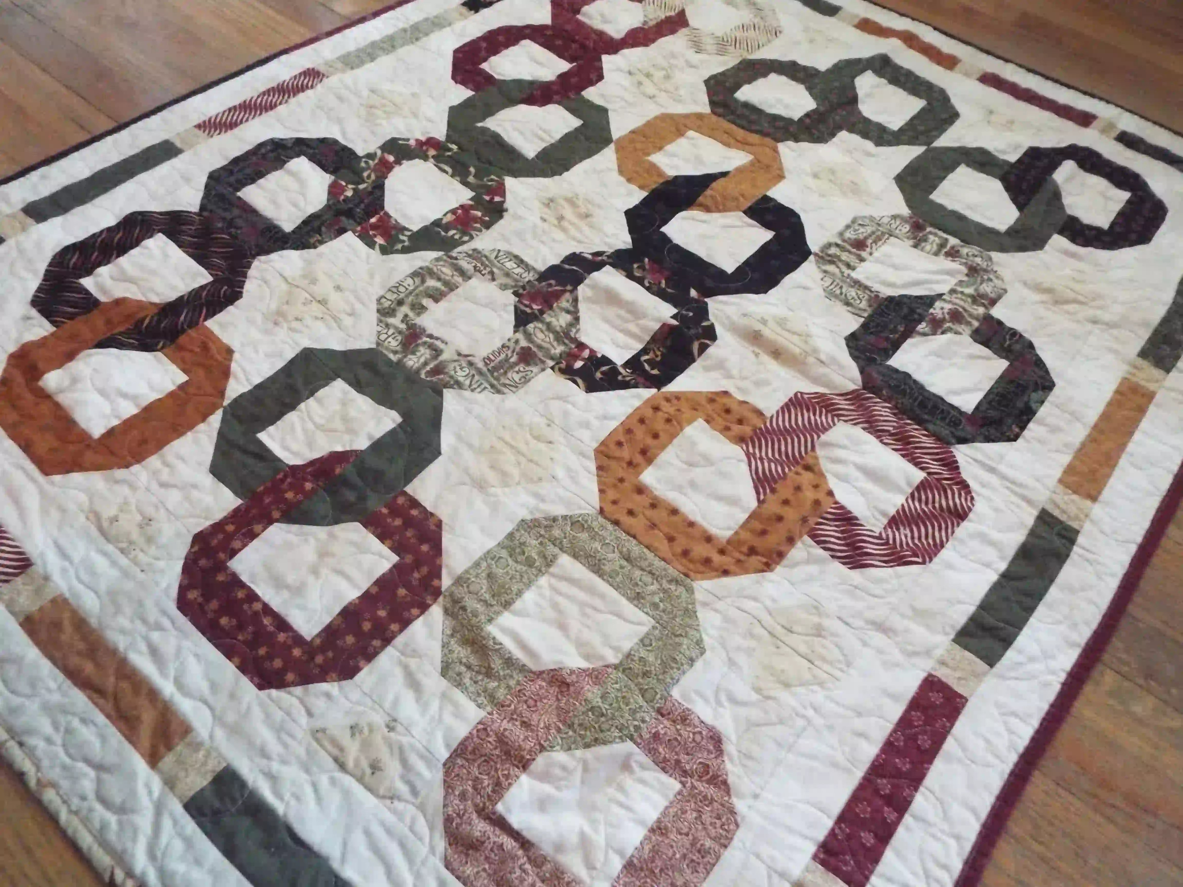 Alternate lay of Fireside Links Lap Quilt showing entire quilt.