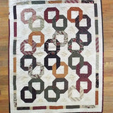 Flat lay of Fireside Links Lap Quilt showing entire quilt.