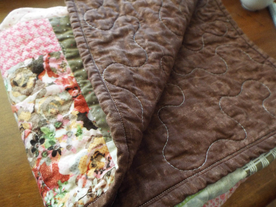 Handmade floral hearts throw showing backing detail